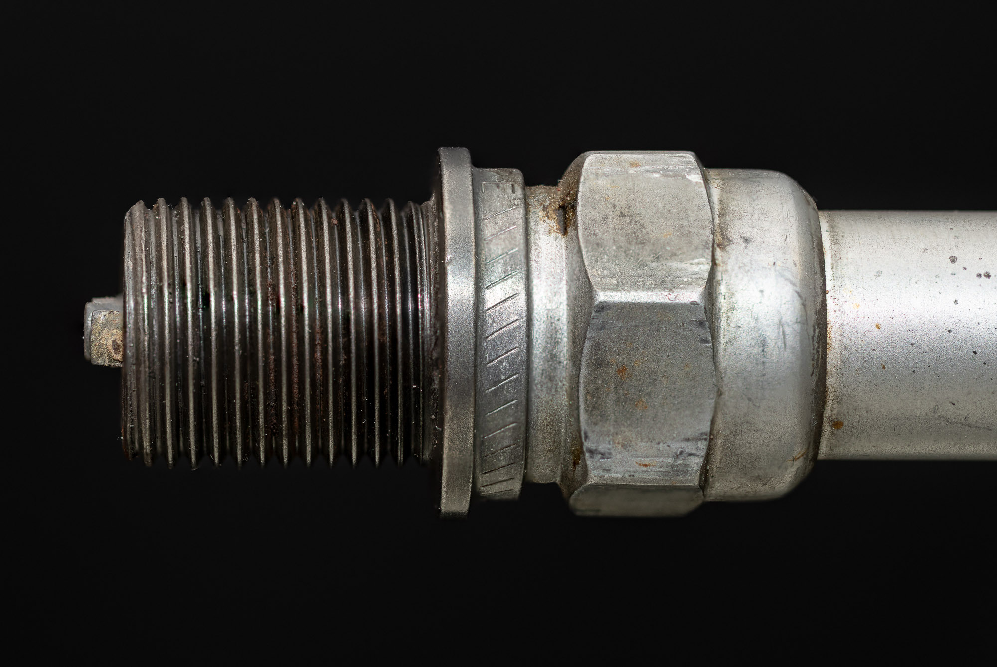 Example of a counterfeit aircraft part compared to an approved OEM part on a workbench